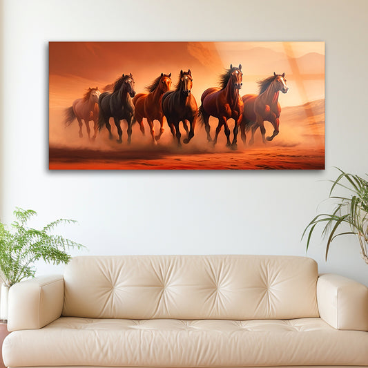 A herd of horses running in the sunset